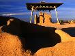 Shelter Over Ruin With Shadowed Rocks In Foreground, Casa Grande Ruins National Monument, Arizona by Eddie Brady Limited Edition Print