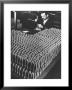 Rows Of 15 Cm Shells On Table Where Worker Uses Hammer And Stamping Tool At Skoda Munitions Factory by Margaret Bourke-White Limited Edition Print