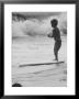 Little Boy Standing On A Surf Board Staring At The Water by Allan Grant Limited Edition Pricing Art Print