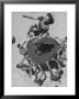 Teenaged Boys Using Blanket To Toss Their Friend, Norma Baker, Into The Air On The Beach by John Florea Limited Edition Print