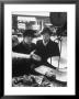 The Butcher Rationing The Amount Of Meat Sold To The Customers Because Of The Postwar Meat Shortage by Cornell Capa Limited Edition Print