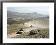 Humvees Traverse Rugged Mountain Roads by Stocktrek Images Limited Edition Print