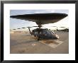 Uh-60 Blackhawk Medivac Helicopter Sits On The Flight Deck At Camp Warhorse by Stocktrek Images Limited Edition Print