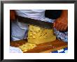 Slicing Of Block Of Cheese, Freising, Germany by Wayne Walton Limited Edition Print