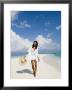 Young Woman Walking On Kuramathi Sandbank, Rashdoo Atoll, Alifu, Maldives by Felix Hug Limited Edition Print