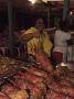 Local Woman Selling Lobsters At The Seafood Friday Night, Anse La Raye, St. Lucia, West Indies by Yadid Levy Limited Edition Print