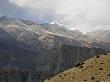 Colorful Dry Hills In Mustang, Nepal With A Snowy Mist In The Sky by Stephen Sharnoff Limited Edition Pricing Art Print