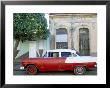 Old American Car Parked On Street Beneath Fruit Tree, Cienfuegos, Cuba, Central America by Lee Frost Limited Edition Print