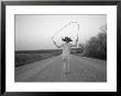 A Girl Jumps Rope Down A Gravel Road In Nebraska by Joel Sartore Limited Edition Print