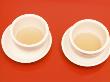 Close-Up Of Two Tea Cups On Red Table For Chinese Tea Ceremony by Images Monsoon Limited Edition Print