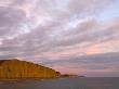 Towering Sandstone Cliffs At West Bay On The Jurassic Coast, Dorset, England, Uk by Adam Burton Limited Edition Print