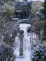 Winter At Woodchippings, Northamptonshire, December: View To Arch Along Path With Sundial In Snow by Clive Nichols Limited Edition Print