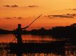 Gaucho Poling Canoe At Sunset, Ibera Marshes National Reserve, Argentina, South America by Ross Couper-Johnston Limited Edition Print