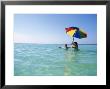 Young Women In Ocean With Umbrella by Mark Gibson Limited Edition Print