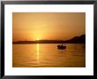 Boat In St. Thomass Bay At Pefkos At Sunset, Greece by Ian West Limited Edition Print