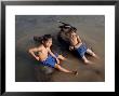 Two Boys Bathe With Their Water Buffalo In The Mekong River, Eastern Cambodia, Indochina by Andrew Mcconnell Limited Edition Print