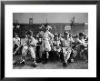 Boys Club Little League Baseball Players Putting On Their Uniforms Prior To Playing Game by Yale Joel Limited Edition Print