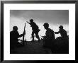 Four Soldiers With Helmets And Rifles Moving On Crest Of Ridge, Patroling At Night by Michael Rougier Limited Edition Pricing Art Print
