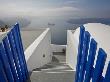 View From The Village Of Oia Perched On Steep Cliffs Overlooking The Submerged Caldera, Santorini, by Ron Watts Limited Edition Pricing Art Print