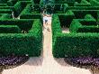 Girl Jumping In Maze At Missouri Botanical Garden, St. Louis, Missouri by Eddie Brady Limited Edition Print