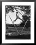 Kenneth Merriman Swinging On Tree Limb After Kicking Away Stilts by Robert W. Kelley Limited Edition Pricing Art Print