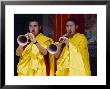 Monks Blowing Flutes Outside A Gompa (Tibetan Monastery), Bodhnath, Katmandu, Nepal by Marco Simoni Limited Edition Print