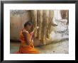 Novice Buddhist Monk And Phra Atchana Buddha Statue, Sukhothai Province, Thailand by Gavin Hellier Limited Edition Print