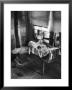 Victoria Cooper's Children Peering In Window Where Newborn Baby Lies In Crib Made From Fruit Crate by W. Eugene Smith Limited Edition Print