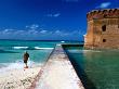 Tourist Near Moat Wall Of Fort Jefferson, Garden Key by Eddie Brady Limited Edition Print