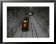 Train Approaches Through Falling Snow At Dusk by Stephen St. John Limited Edition Print