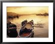 Sunset Setting Over Two Boats At A Fishing Harbour And Marina On The Bay Of Naples In Naples, Italy by Richard Nowitz Limited Edition Print