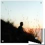 Man Sitting On Hillside At Sunrise by I.W. Limited Edition Print