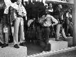 Male Store Attendant In A Clothes Shop Window by Shirley Baker Limited Edition Pricing Art Print