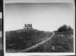 View Of A Large, Solitary House Atop A Hill With A Dirt Drive Leading Up To It by Wallace G. Levison Limited Edition Pricing Art Print