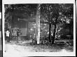 Two Men Standing Near A Street Telescope That Is Osbc. From View by Wallace G. Levison Limited Edition Print