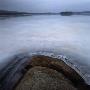 Rocks Sticking Out Of A Frozen Lake by Mikael Andersson Limited Edition Print