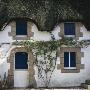 Thatched Cottage With Blue Shutters, Grand Briere, Brittany by Joe Cornish Limited Edition Print