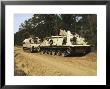 An M-88 Recovery Vehicle Begins To Tow An M992 Field Artillery Ammunition Supply Vehicle by Stocktrek Images Limited Edition Pricing Art Print