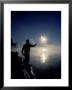 Silhouette Of Fisherman Casting A Line Into Lake, Ontario, Canada by Mark Carlson Limited Edition Pricing Art Print