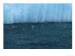 Snow Flakes Drifting Past A Blue Iceberg by Ralph Lee Hopkins Limited Edition Print