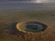 An Aerial View Of A Meteor Impact Crater Near The Town Of Halls Creek by Randy Olson Limited Edition Print