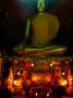 Candles And Offerings In Front Of Seated Buddha Statue, Khili Temple, Luang Prabang, Laos by Alain Evrard Limited Edition Print