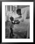 Roman Catholic Priest Chatting With Healing Child by Terence Spencer Limited Edition Print