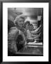 Line Of Operators At Macy's Main Switchboard, With Alice Lennon Flipping Through A Rolodex File by Nina Leen Limited Edition Pricing Art Print