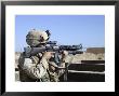 Us Marine Sites Through The Scope Atop His 556Mm M16a2 Rifle by Stocktrek Images Limited Edition Print