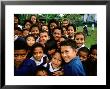 Group Of Schoolchildren Smiling, Upolu, Samoa by Peter Hendrie Limited Edition Pricing Art Print