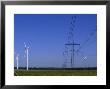 Windmills And High Voltage Transmission Lines In A Clear Blue Sky, Mecklenburg-Vorpommern, Germany by Norbert Rosing Limited Edition Print