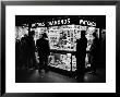 Customers Peering At The Wares Inside A Small, Brightly Lit Times Square Jewelry And Watch Shop by Peter Stackpole Limited Edition Print