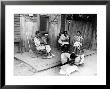 African American Women Sitting On The Porch Of Their Ramshackle House Watching Their Children Play by Alfred Eisenstaedt Limited Edition Print