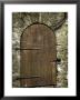 Detail Of Old Wooden Door In Stone Wall, Tallinn, Estonia by Nancy & Steve Ross Limited Edition Pricing Art Print